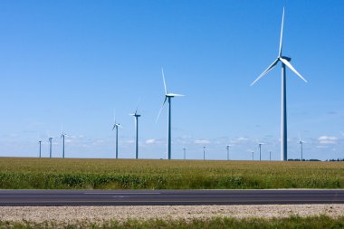 Modern Windmill Generators along the Interstate clipart