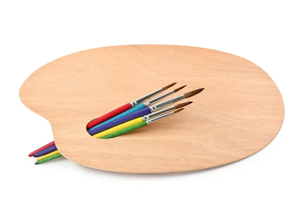 Painter's palette with paintbrushes — Stock Photo, Image