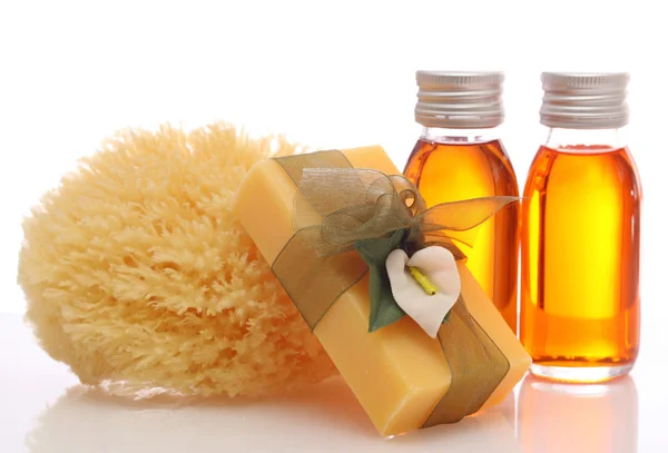 Bottles with essential oils and sponge — Stock Photo, Image
