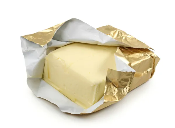 Butter in gold foil — Stock Photo, Image