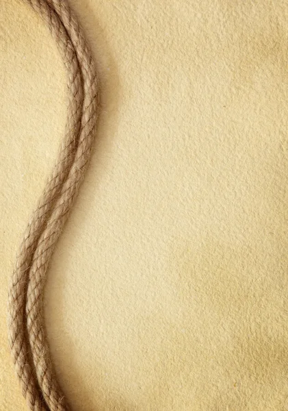 Верёвка на старой бумаге — стоковое фото