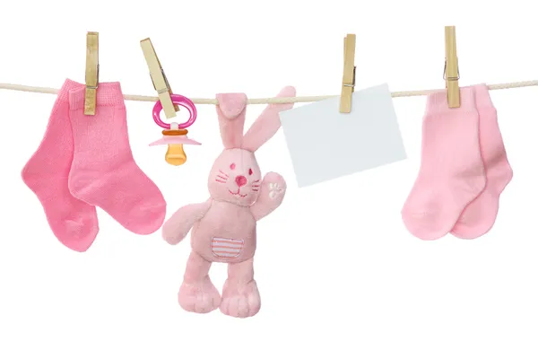 Artículos de bebé rosa y nota en blanco —  Fotos de Stock