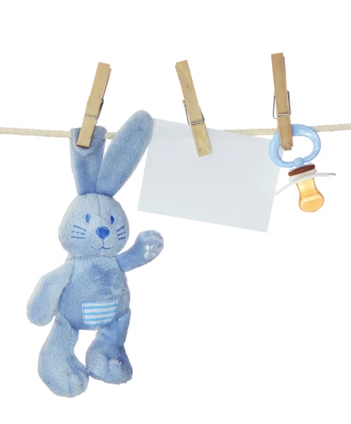 Artículos de bebé azul y nota en blanco — Foto de Stock