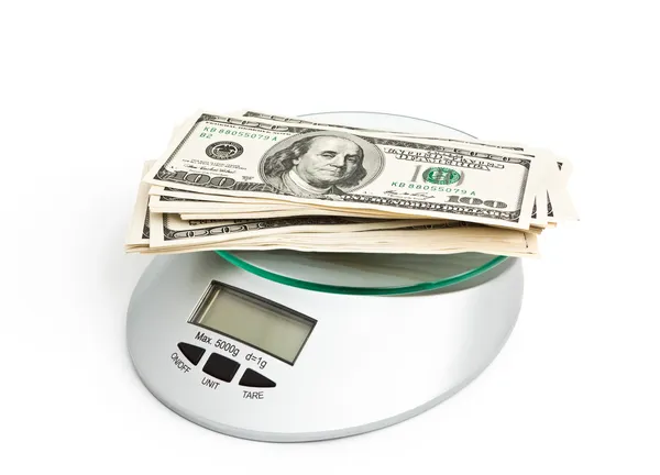 Stack of one hundred dollars on a Scales — Stock Photo, Image