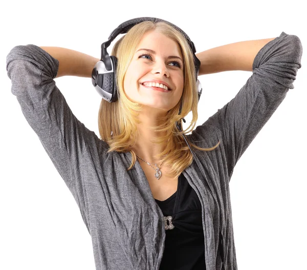 Mooi jong meisje geniet van het luisteren muziek — Stockfoto
