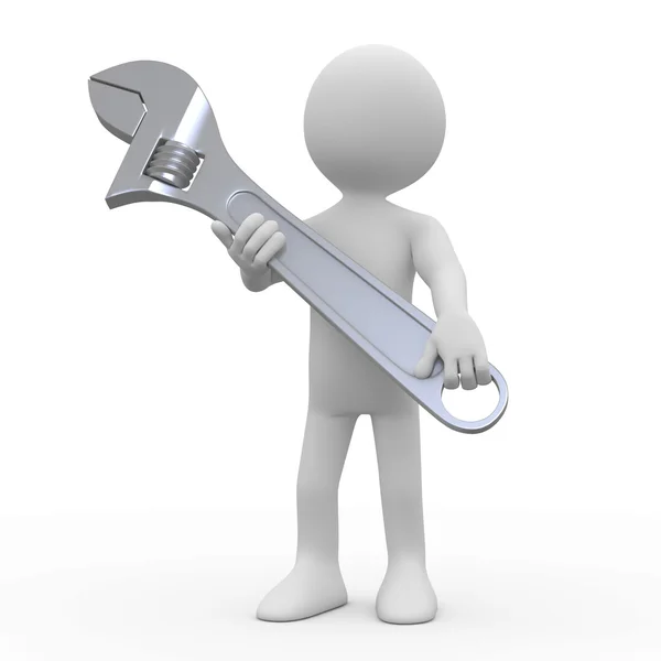 Man with a huge adjustable spanner — Stock Photo, Image