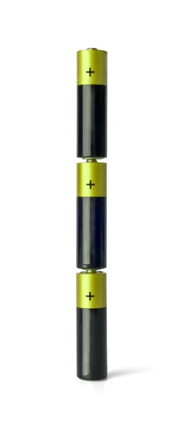 Column of three yellow AA batteries — Stock Photo, Image