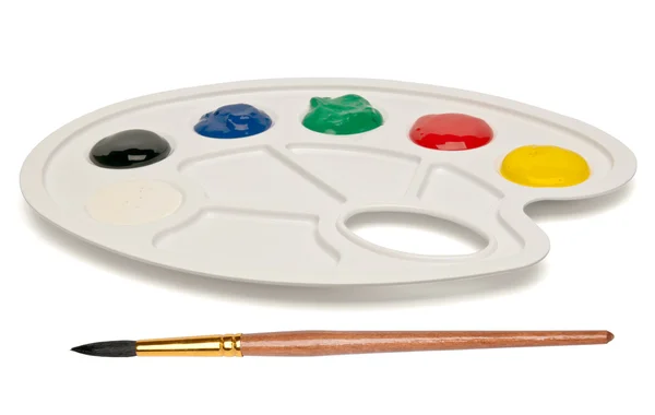 Plastic palette with a brush and paints — Stock Photo, Image