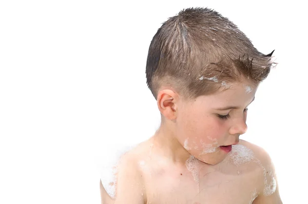 stock image A boy swims in the bathtub