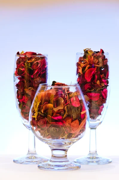 Glass with dried leaves — Stock Photo, Image