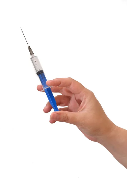Hand with a syringe — Stock Photo, Image