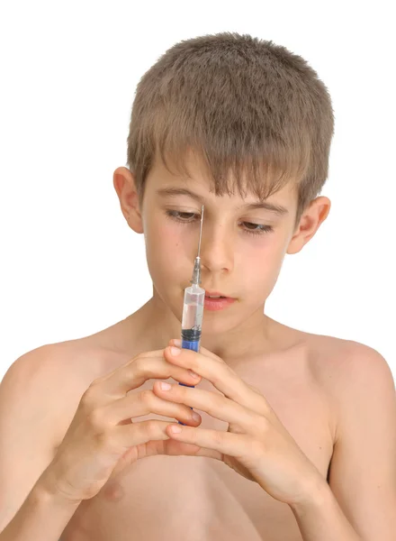 The boy and the syringe — Stock Photo, Image