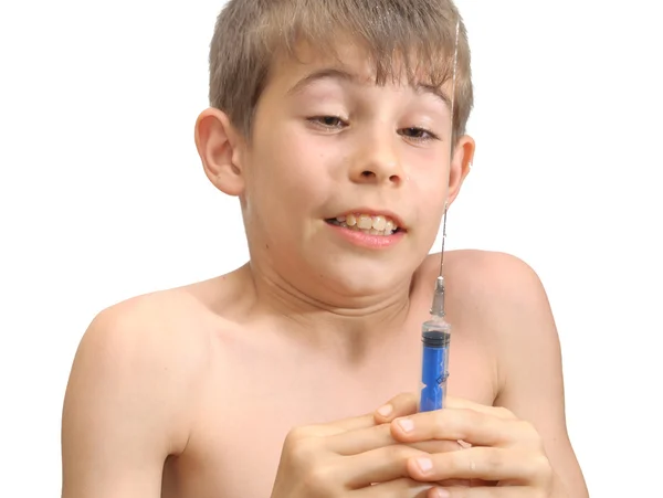 Chłopiec i strzykawki — Zdjęcie stockowe