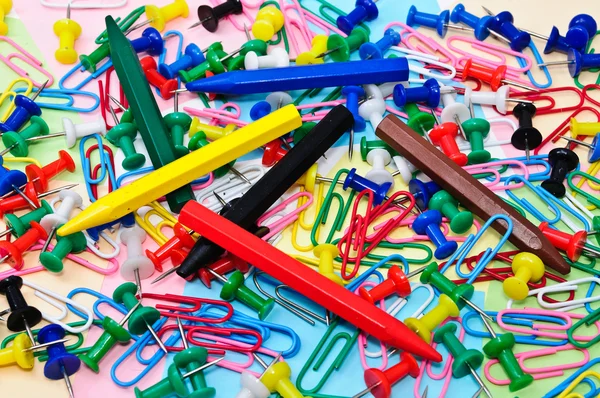 Colored paper clips and pins Royalty Free Stock Photos
