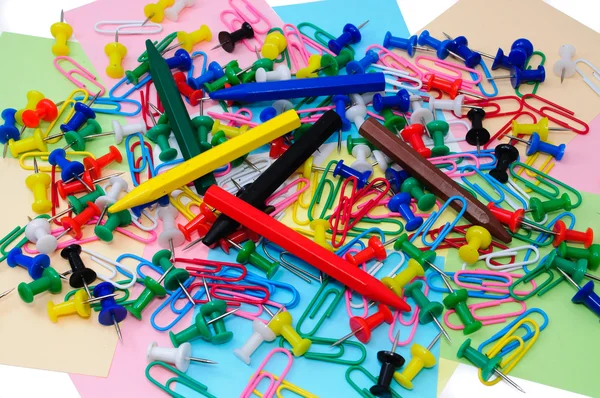Colored paper clips and pins Royalty Free Stock Images