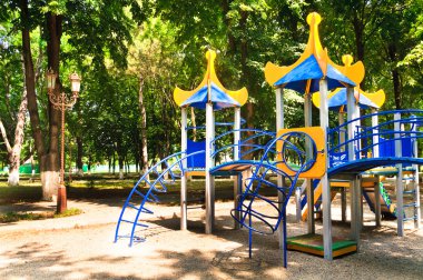 Children's playground in the park clipart