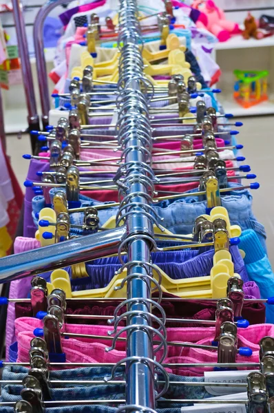 stock image Rows of clothes on hangers