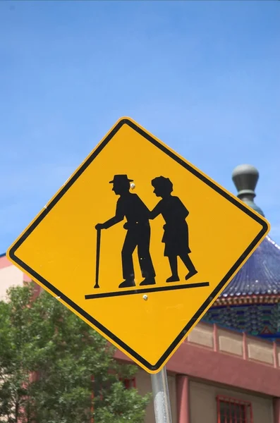 Seniors crossing — Stock Photo, Image