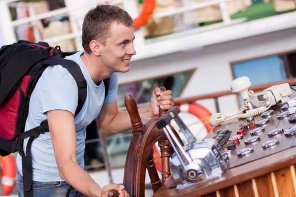 stock image Man is steering the helm