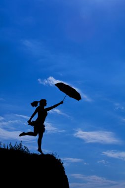 Silhouette of girl flight with umbrella clipart