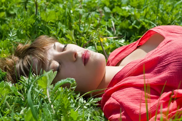 stock image Beautiful girl lying in the grass