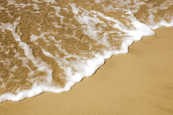 Sand und Meeresschaum — Stockfoto