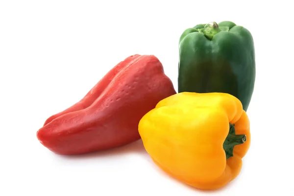 Red green and yellow sweet pepper on a white background — Stock Photo, Image