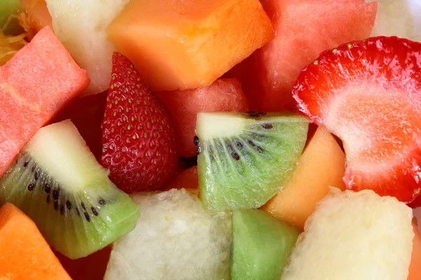 Bakgrunn av frisk fruktsalat – stockfoto
