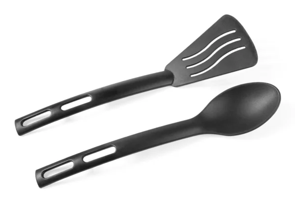 Black plastic spatula and spoon — Stock Photo, Image