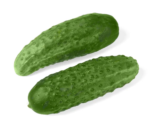 Twee geïsoleerde komkommers — Stockfoto