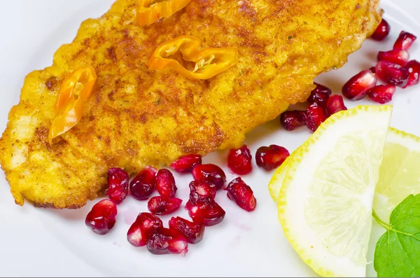 Breaded chicken's breast with pomegranate — Stock Photo, Image