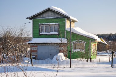 Cottage in the winter. clipart