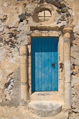 Blue door with columns, Akrotiri, Santorini. clipart