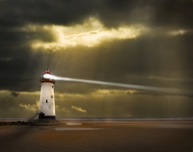 Lighthouse with beam and stormy sky