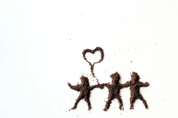Μικρές φιγούρες των ανθρωπογενών σε σκόνη σοκολάτας — Φωτογραφία Αρχείου