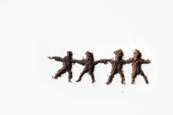 Small figures of men made in chocolate powder — Stock Photo, Image