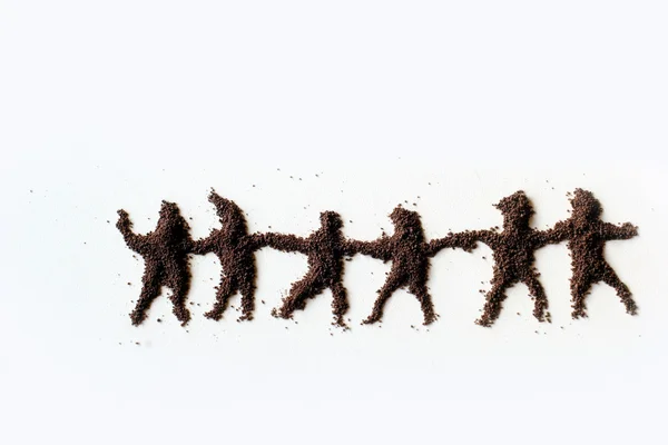 Small figures of men made in chocolate powder — Stock Photo, Image
