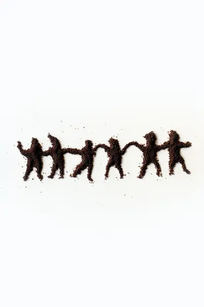 Small figures of man made in chocolate powder — Stock Photo, Image