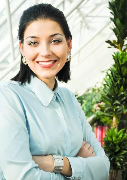 Young business woman in office interior — Stock Photo, Image
