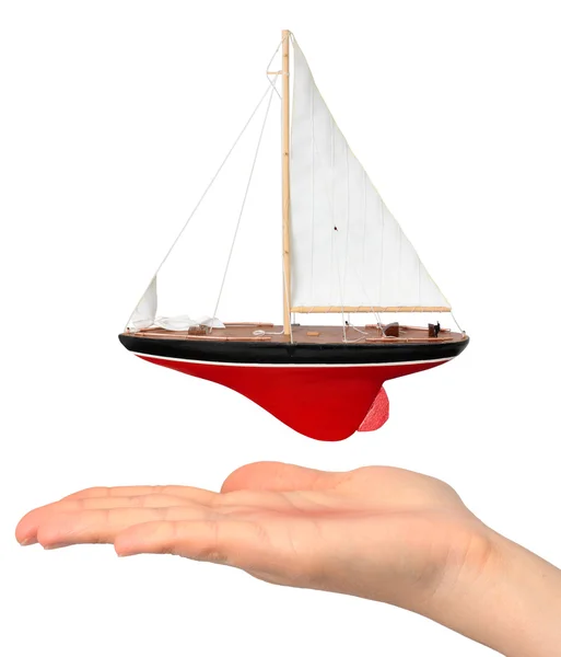 stock image Hand with yacht model