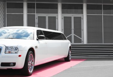 White limousine near office building clipart