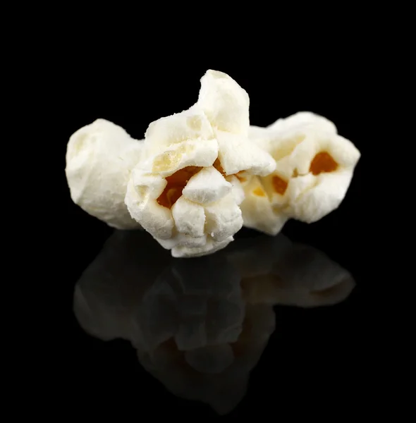 Popcorn on black — Stock Photo, Image