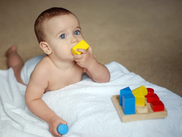 Baby with brick — Stock Photo, Image