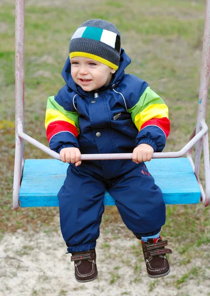 Happy boy on swing — Stock Photo, Image