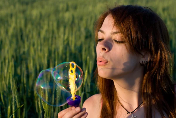 Young woman and bubbles — Stock Photo, Image