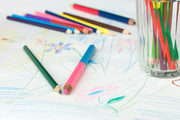 Crayons on a child's drawing — Stock Photo, Image