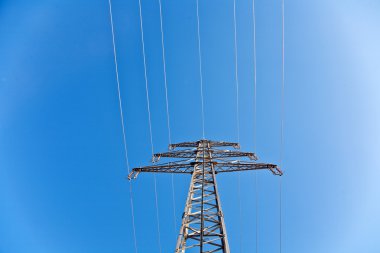 Electricity high voltage tower with blue sky clipart