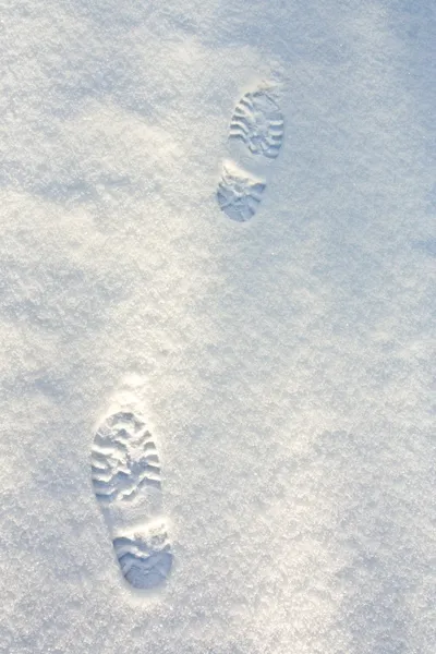 Footsteps in the blue snow — Stock Photo, Image