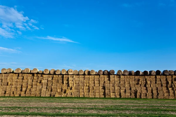 Bale of straw with blue sky — Stock Photo, Image