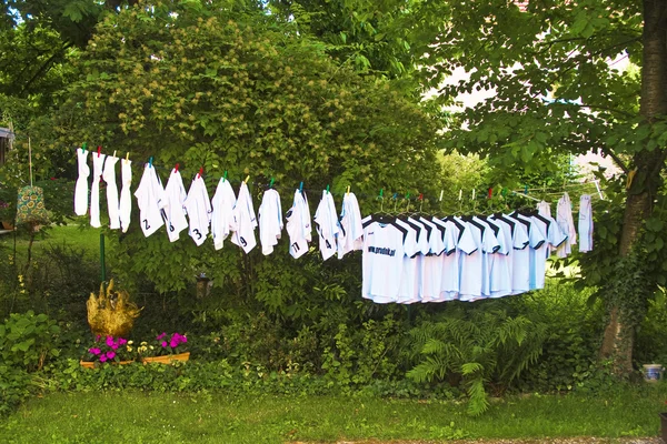 Football tricots of the whole team are washed and drying in the sun — Stock Photo, Image